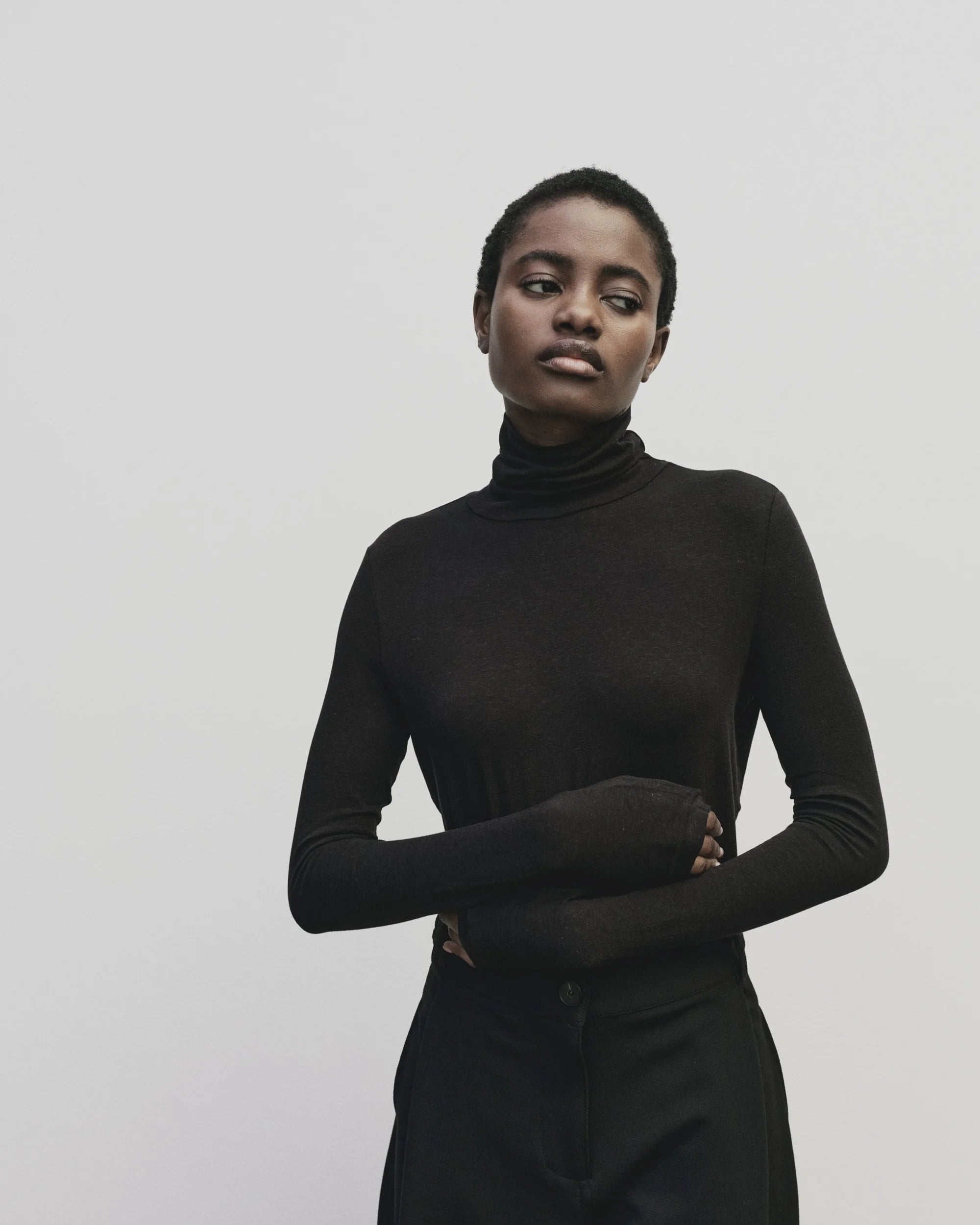 MIJEONG PARK ROLL NECK TOP IN BLACK